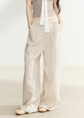 Natural beige linen-blend wide-leg pants with a relaxed fit