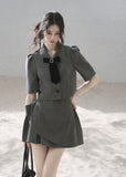 Gray cropped blazer and mini skirt set with black velvet bow