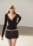 Feminine black lace-detail fitted top styled with denim mini skirt