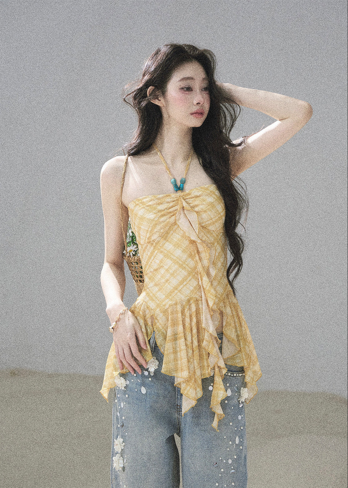 Yellow plaid ruched top with an asymmetric handkerchief hem