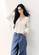 Pale yellow V-neck blouse with double-layer ruffles