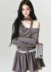 The Migratory Lace Sonata Set drapes the body in Fragileheart’s signature melancholy elegance. A soft ashen knit wraps asymmetrically over lace, revealing just enough fragility beneath structure. Paired with a flowing skirt trimmed in translucent lace, it moves like twilight — graceful, introspective, and quietly magnetic.