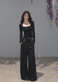 Black fitted long-sleeve top with a softly squared neckline