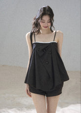 Black tailored cami and shorts set with contrasting white trim