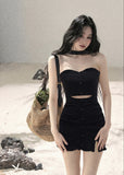 Black halter cutout knit mini dress with fitted silhouette and front button details