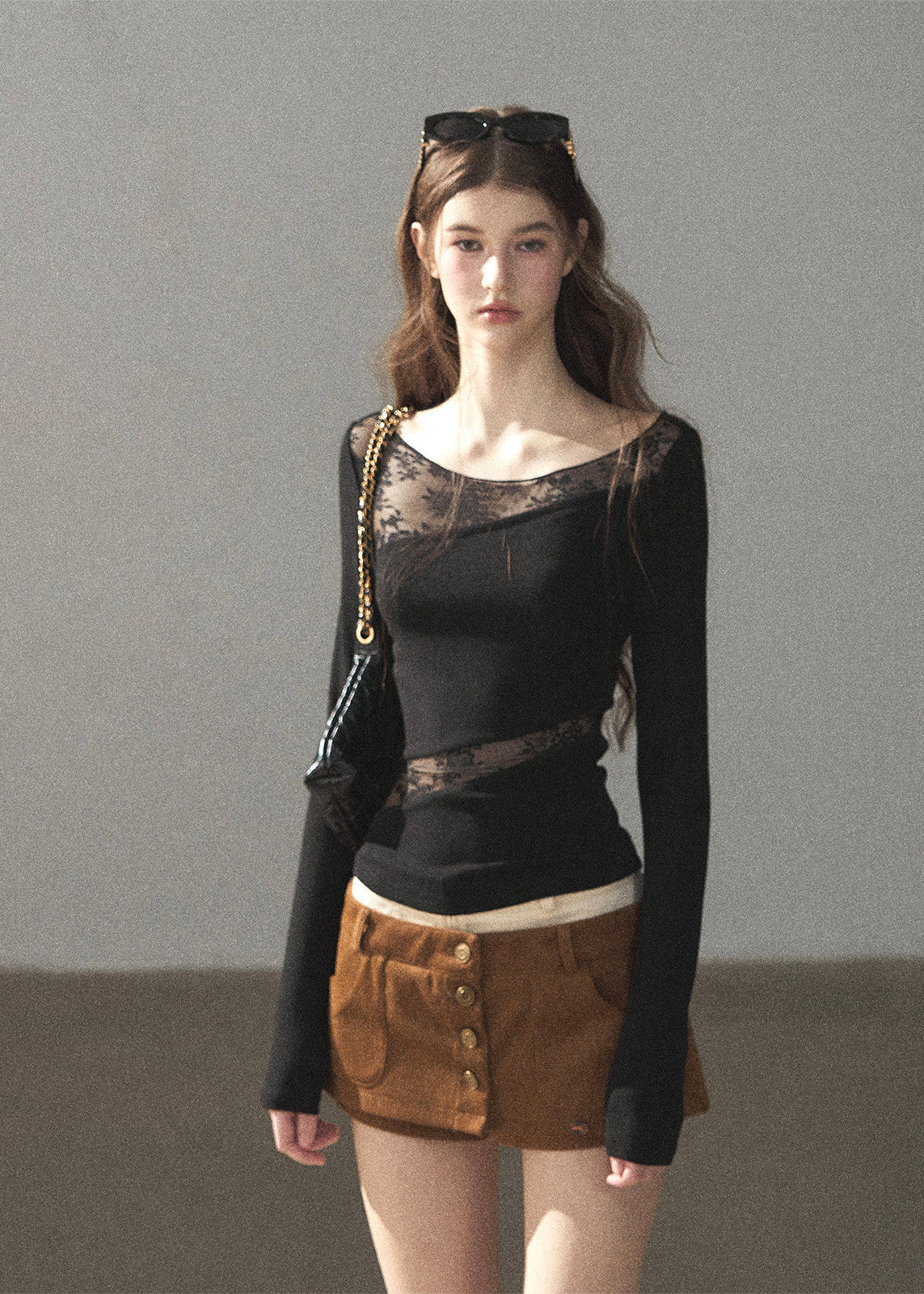 Romantic fitted lace top styled with mini shorts