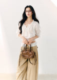 White cotton blouse with gathered wave pleats and puff sleeves