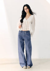 Washed blue straight-leg cotton trousers with a relaxed fit