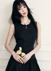 A constellation of refinement — the Noir Étoile Ensemble merges classic Parisian tailoring with Fragileheart’s pastel-noir sensuality. The cropped glitter tweed jacket and sculpted mini dress shimmer with quiet confidence, revealing both softness and strength. Perfect for evenings when sophistication meets modern rebellion.