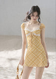 Golden yellow plaid mini dress with white floral lace trim