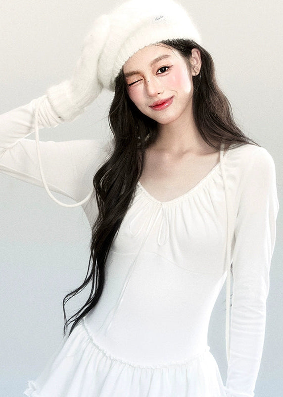 Fragileheart knit dress, ballet style outfit, ivory ruffle one-piece, luxury Korean fashion, quiet luxury womenswear, pastel noir aesthetic, elegant autumn dress, V-neck knit outfit, pre-autumn K-fashion, romantic feminine style, tiered ruffle skirt, soft Korean fashion, delicate white dress, graceful knit one-piece