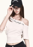 White asymmetric crop tee styled with black shorts