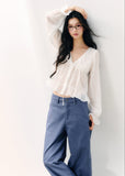 Pale yellow V-neck blouse with double-layer ruffles