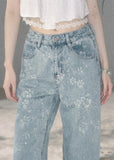 Light blue floral wide-leg jeans with sparkling embellishments