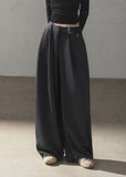 Model wearing taupe loose wide-leg pants