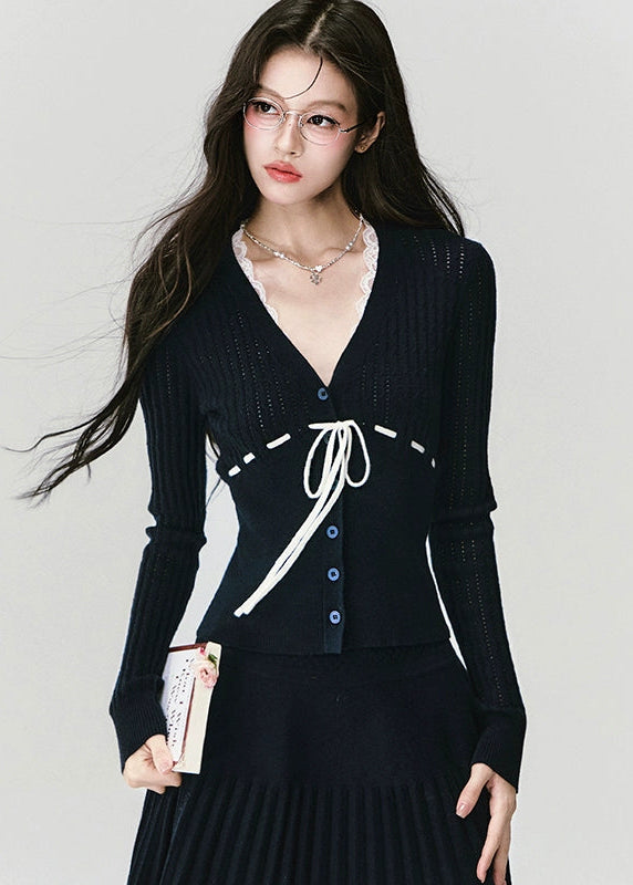 Fragileheart knit skirt set, black pleated two-piece, luxury Korean fashion, elegant autumn outfit, quiet luxury womenswear, pastel noir aesthetic, V-neck cardigan set, modern feminine K-fashion, minimalist ribbed knit, poetic fashion 2025, romantic fall outfit, delicate Korean style, sophisticated knitwear set, graceful pleated skirt look