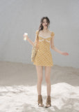 French-inspired yellow dress with a lace-trimmed neckline