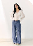 Washed blue straight-leg cotton trousers with a relaxed fit