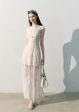 Model wearing an ivory lace dress with a fitted silhouette