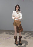 Ivory ribbon-tie cropped blouse with a softly gathered waist