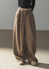 Taupe wide-leg pants with relaxed autumn styling