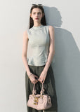 Light blue waist-cinching sleeveless blouse