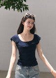 Slim navy wool-blend top styled with denim