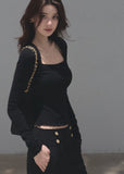Black fitted long-sleeve top with a softly squared neckline