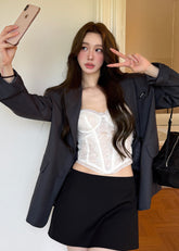 Charcoal gray oversized blazer with notched lapels and a two-button front