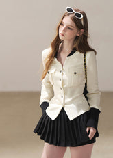 Ivory contrast trim waffle knit cardigan with black pleated mini skirt