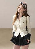 Ivory contrast trim waffle knit cardigan with black pleated mini skirt