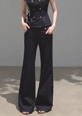 Model wearing a dark denim double-breasted mini dress with a matching belt