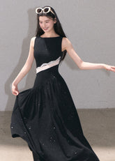 Black sleeveless maxi dress with delicate lace cutout