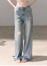 Light wash wide-leg jeans with rhinestone details