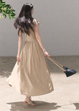 Beige tie-detail maxi dress with flowing skirt