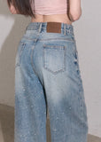 Light wash wide-leg jeans with rhinestone details