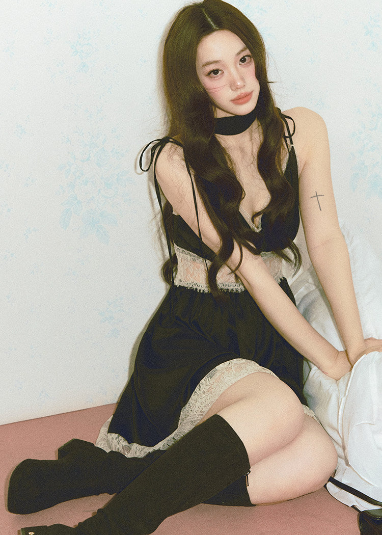 Close view of black slip dress with soft lace trim