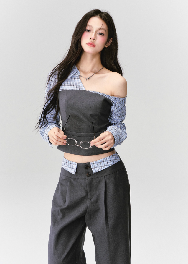 Where intellect meets allure — the Philosophical Trajectory Set redefines structured femininity through sculpted tailoring and poetic imbalance. The asymmetric neckline bares one shoulder in quiet defiance, merging plaid intellect with charcoal precision. Designed for the woman whose grace carries both thought and edge.