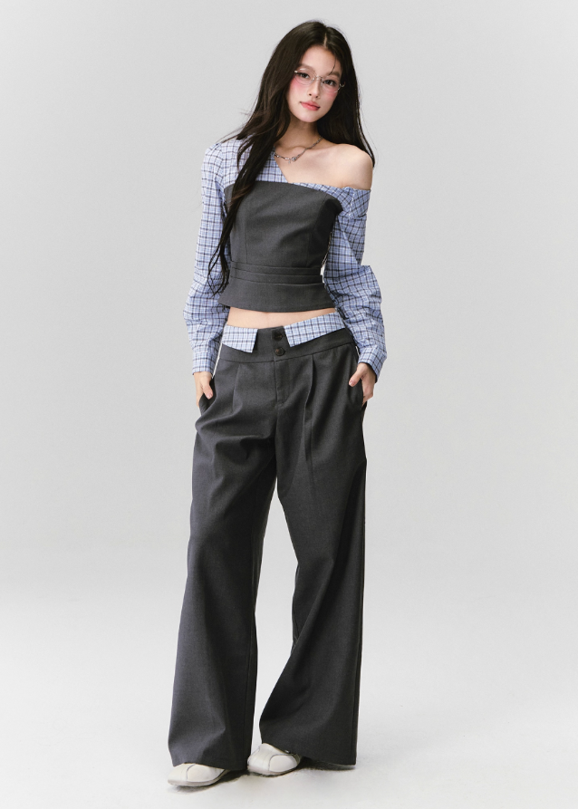 Where intellect meets allure — the Philosophical Trajectory Set redefines structured femininity through sculpted tailoring and poetic imbalance. The asymmetric neckline bares one shoulder in quiet defiance, merging plaid intellect with charcoal precision. Designed for the woman whose grace carries both thought and edge.