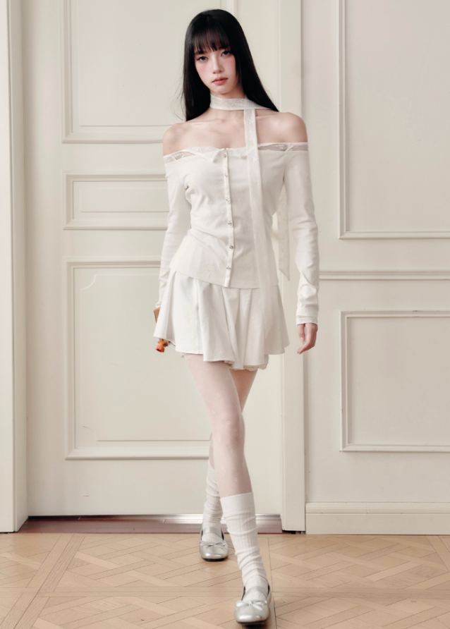 Ethereal and composed, the White Moonlight Sonata Set embodies Fragileheart’s quiet-luxury vision. The off-shoulder lace top and embroidered skirt whisper of moonlit evenings and polished confidence. Soft satin sheen meets delicate tailoring, creating a timeless silhouette that speaks of grace without needing attention.