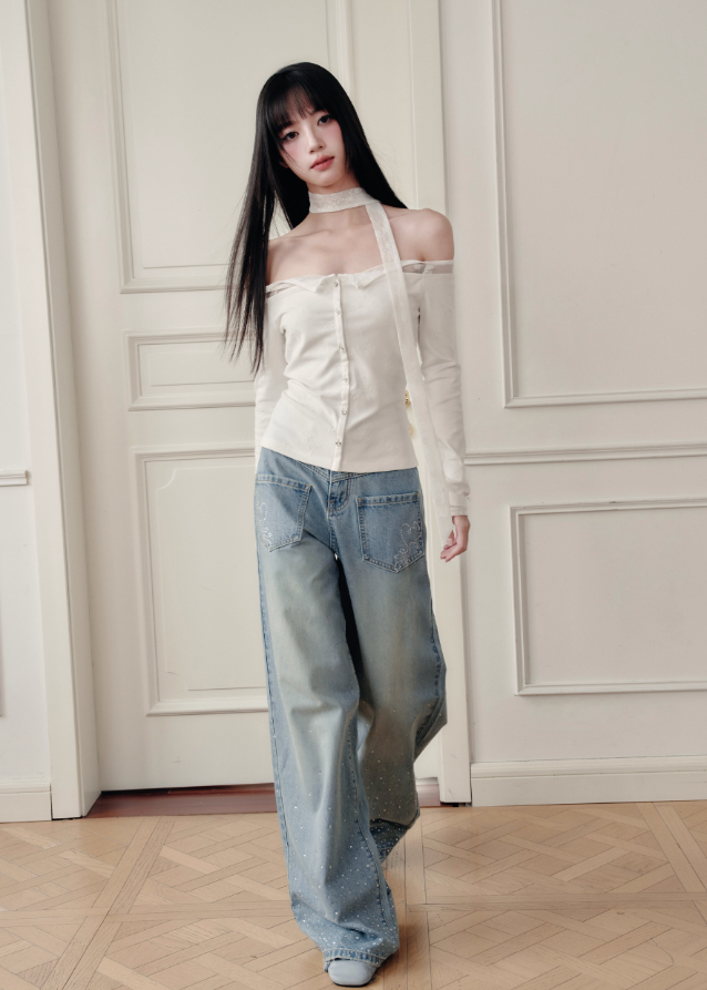 Ethereal and composed, the White Moonlight Sonata Set embodies Fragileheart’s quiet-luxury vision. The off-shoulder lace top and embroidered skirt whisper of moonlit evenings and polished confidence. Soft satin sheen meets delicate tailoring, creating a timeless silhouette that speaks of grace without needing attention.