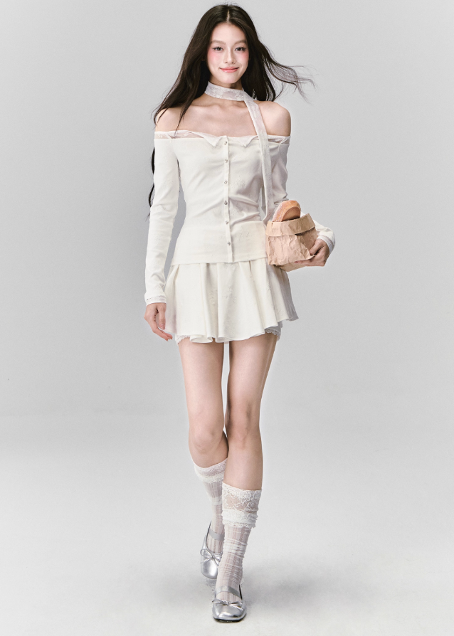 Ethereal and composed, the White Moonlight Sonata Set embodies Fragileheart’s quiet-luxury vision. The off-shoulder lace top and embroidered skirt whisper of moonlit evenings and polished confidence. Soft satin sheen meets delicate tailoring, creating a timeless silhouette that speaks of grace without needing attention.