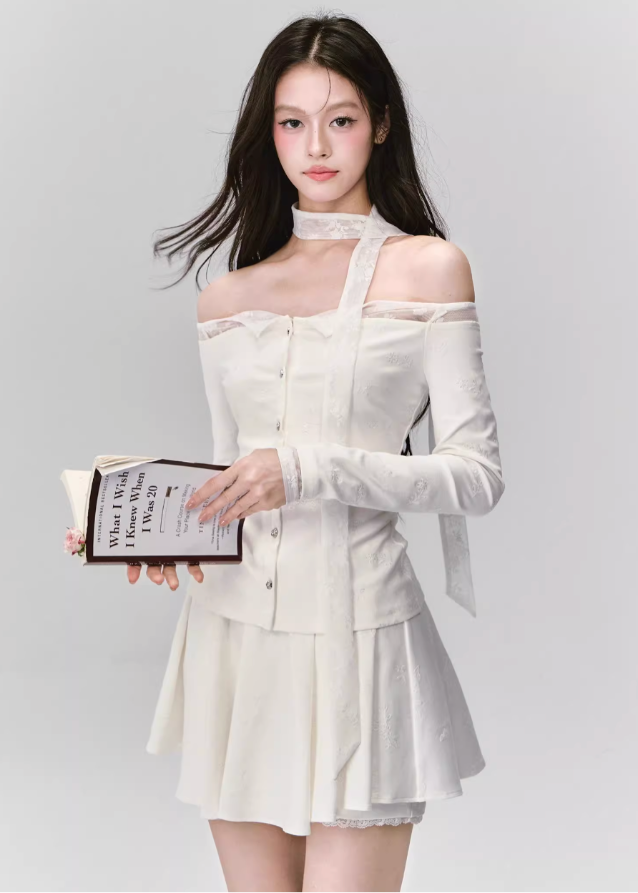 Ethereal and composed, the White Moonlight Sonata Set embodies Fragileheart’s quiet-luxury vision. The off-shoulder lace top and embroidered skirt whisper of moonlit evenings and polished confidence. Soft satin sheen meets delicate tailoring, creating a timeless silhouette that speaks of grace without needing attention.