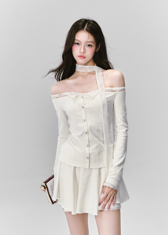 Ethereal and composed, the White Moonlight Sonata Set embodies Fragileheart’s quiet-luxury vision. The off-shoulder lace top and embroidered skirt whisper of moonlit evenings and polished confidence. Soft satin sheen meets delicate tailoring, creating a timeless silhouette that speaks of grace without needing attention.