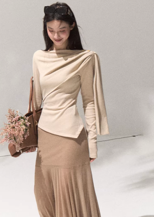 OAKMOO wrap knit top, asymmetric draped blouse women, off shoulder knit top, sculpted long sleeve shirt, chic street fashion top, minimalist Korean knitwear, modern wrap blouse, autumn winter fashion 2025, OAKMOO AW collection, stylish off shoulder top