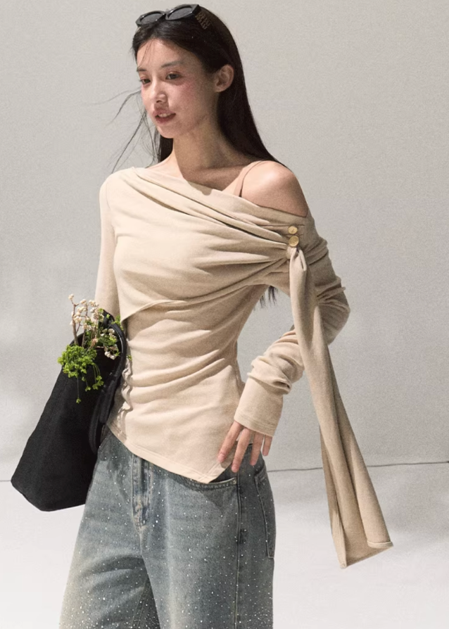 OAKMOO wrap knit top, asymmetric draped blouse women, off shoulder knit top, sculpted long sleeve shirt, chic street fashion top, minimalist Korean knitwear, modern wrap blouse, autumn winter fashion 2025, OAKMOO AW collection, stylish off shoulder top