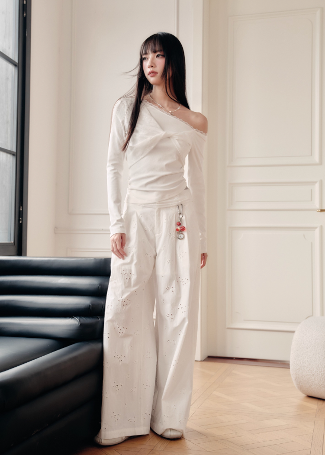 Fragileheart off-shoulder top, white lace blouse, asymmetric draped shirt, luxury Korean fashion, elegant feminine outfit, quiet luxury style, pastel noir aesthetic, winter 2025 collection, modern romantic fashion, ivory one-shoulder knit, soft lace trim top, minimalist luxury wear, Korean chic fashion, delicate off-shoulder blouse
