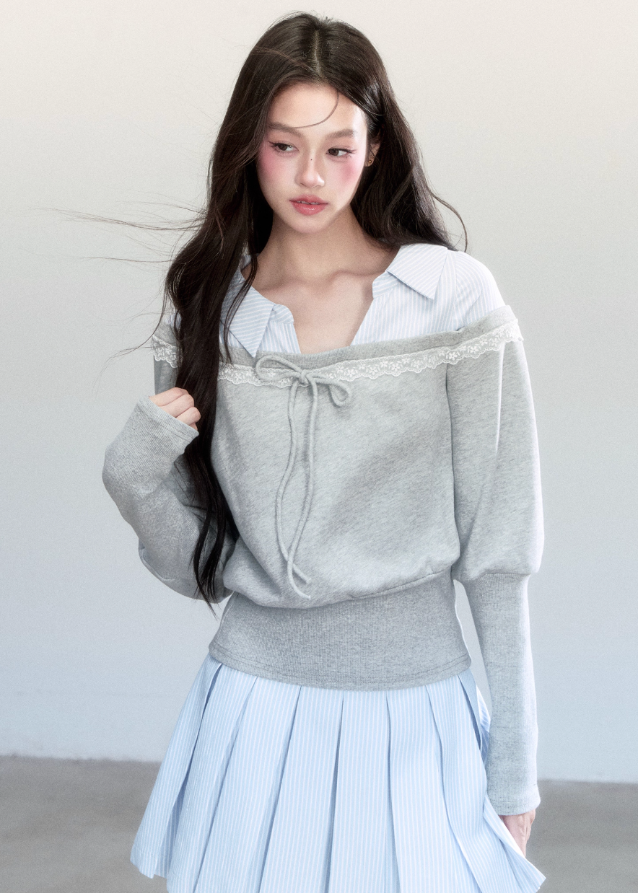 Fragileheart layered set, blue striped pleated skirt, luxury Korean fashion, preppy K-fashion outfit, faux two-piece knit top, quiet luxury womenswear, pastel noir aesthetic, elegant school style, 2025 autumn collection, modern feminine outfit, soft grey sweatshirt set, chic Korean look, academic romantic fashion, delicate layered design
