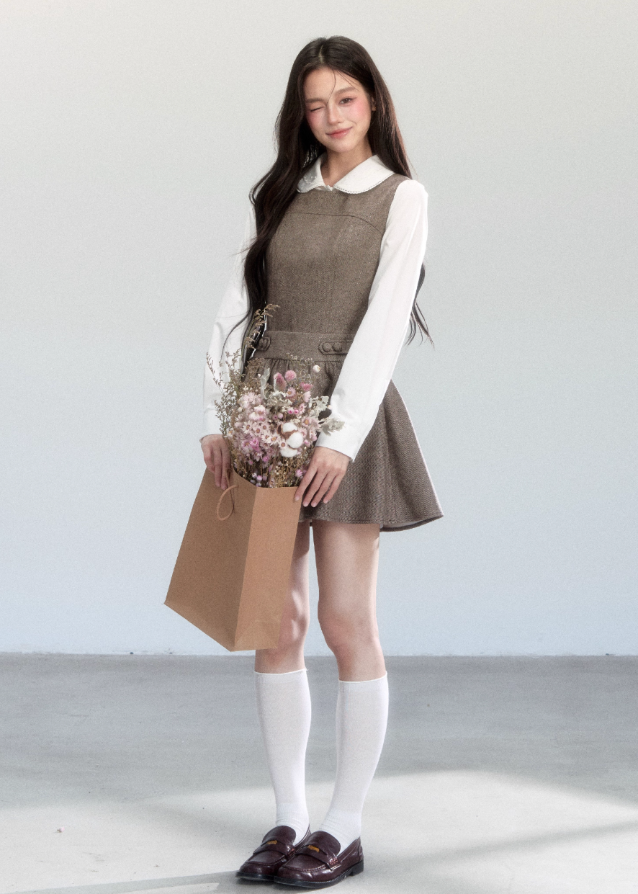 Fragileheart vest dress set, doll collar blouse, luxury Korean fashion, elegant autumn outfit, quiet luxury womenswear, pastel noir aesthetic, preppy Korean fashion, taupe layered dress, K-fashion 2025, modern feminine look, romantic school style, soft brown dress outfit, delicate preppy outfit, refined fall fashion
