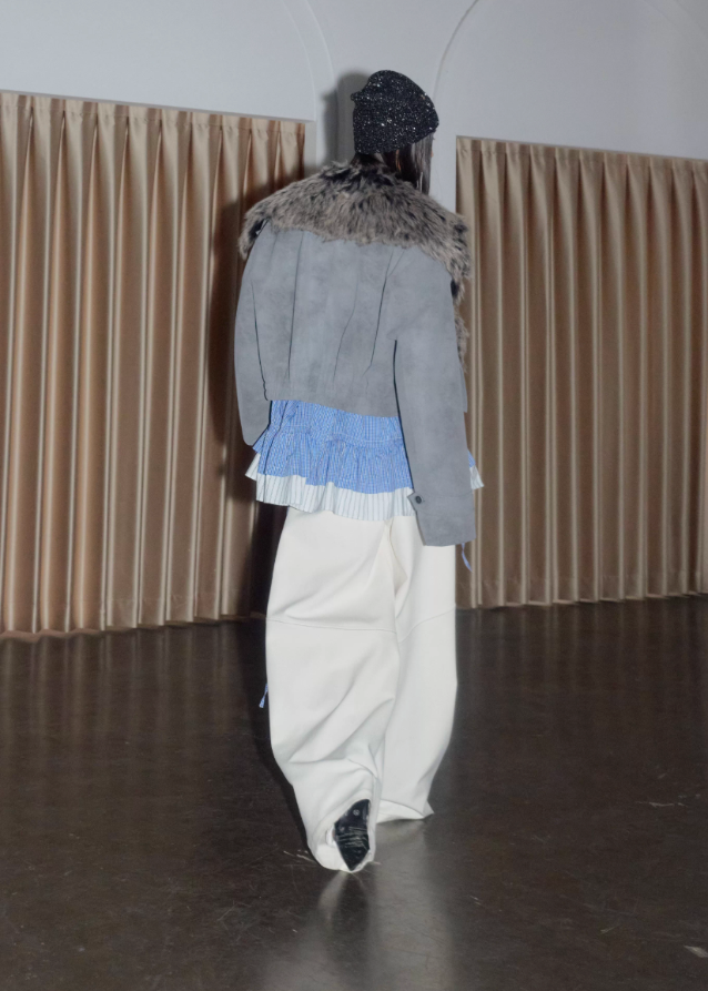 korean street jacket, faux fur collar jacket women, detachable hem jacket, hybrid layered jacket, matte grey PU leather coat, nomadic street style jacket, JNYLON outerwear, fake two piece jacket women, urban grunge fashion, deconstructed winter jacket, asymmetrical hem coat, korean edgy fashion, layered PU leather jacket, faux fur grey jacket women
